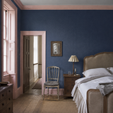 Paintable textured wallpaper in a bedroom, Amber RD838, painted in Royal Sapphire