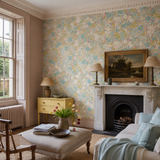 Green floral wallpaper in a drawing room, Flora Blush & Lime by OHPOPSI, with joinery painted in Pure Sunshine