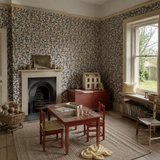 Blue floral wallpaper in a playroom, Flora Ditsy Midnight by OHPOPSI, with joinery painted in Jam First
