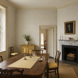 Grey floral wallpaper in a dining room, Flora Ditsy Silver by OHPOPSI, with joinery painted in Antique Gold