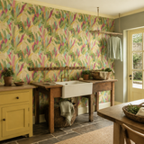 Coral botanical wallpaper in a utility room, Glasshouse Emerald & Coral by OHPOPSI, with joinery painted in Pure Sunshine