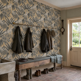 Brown animal print wallpaper in a boot room, Jungle Cheetah - Toffee by OHPOPSI, with joinery painted in Meadow Lilly