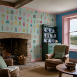 Pink botanical wallpaper in a sitting room, Leaf Boogie Aqua & Raspberry by OHPOPSI, with joinery painted in Green Envy