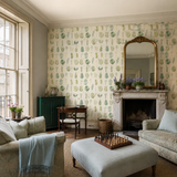Green botanical wallpaper in a drawing room, Leaf Boogie Forest by OHPOPSI, with joinery painted in Green Envy