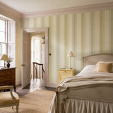 Green striped wallpaper in a bedroom, Multi Stripe - Pistachio Mix by OHPOPSI, with joinery painted in Arcadia