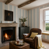 Blue striped wallpaper in a snug, Multi Stripe - Wild Water by OHPOPSI, with joinery painted in Ferns