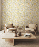 Eden Vol 1 Honeysuckle Leaf Trail Warm Grey wallpaper by Hoopla Walls in a styled living room