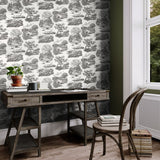 Riches of Nature Eve Toile Noir wallpaper by Ohpopsi shown on a full wall