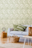 Eden Vol 1 Chrysanthemum Sage Green wallpaper by Hoopla Walls in a styled living room