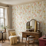 Green floral wallpaper in a dressing room, Pomegranate Trail Olive by OHPOPSI, with joinery painted in Penally Pink