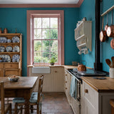 Kitchen painted in Queen's Fisher teal blue eco paint