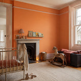 Nursery painted in Spiced Marmalade bright orange eco paint