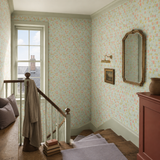 Teal floral wallpaper in a stairwell, Tiny Tulip Duckegg Mix by OHPOPSI, with joinery painted in Red Clover