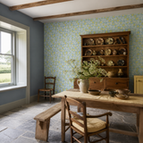 Blue floral wallpaper in a dining room, Tiny Tulip Lime & Sky by OHPOPSI, with joinery painted in Pure Sunshine