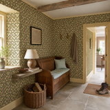 Green floral wallpaper in a hallway, Tiny Tulip Olive Mix by OHPOPSI, with joinery painted in 1969
