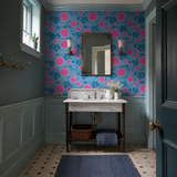Blue botanical wallpaper in a cloakroom, Velina Tropical by Olenka, with joinery painted in Wild Swimming