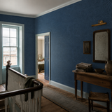 Blue botanical wallpaper in a landing, Venation Ink by OHPOPSI, with joinery painted in Dart Frog