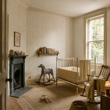 Green botanical wallpaper in a nursery, Venation Mini Sage by OHPOPSI, with joinery painted in Wine Bottle Green
