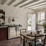 Neutral botanical wallpaper in a kitchen, Verdure Parchment by OHPOPSI, with joinery painted in Secret Cinema